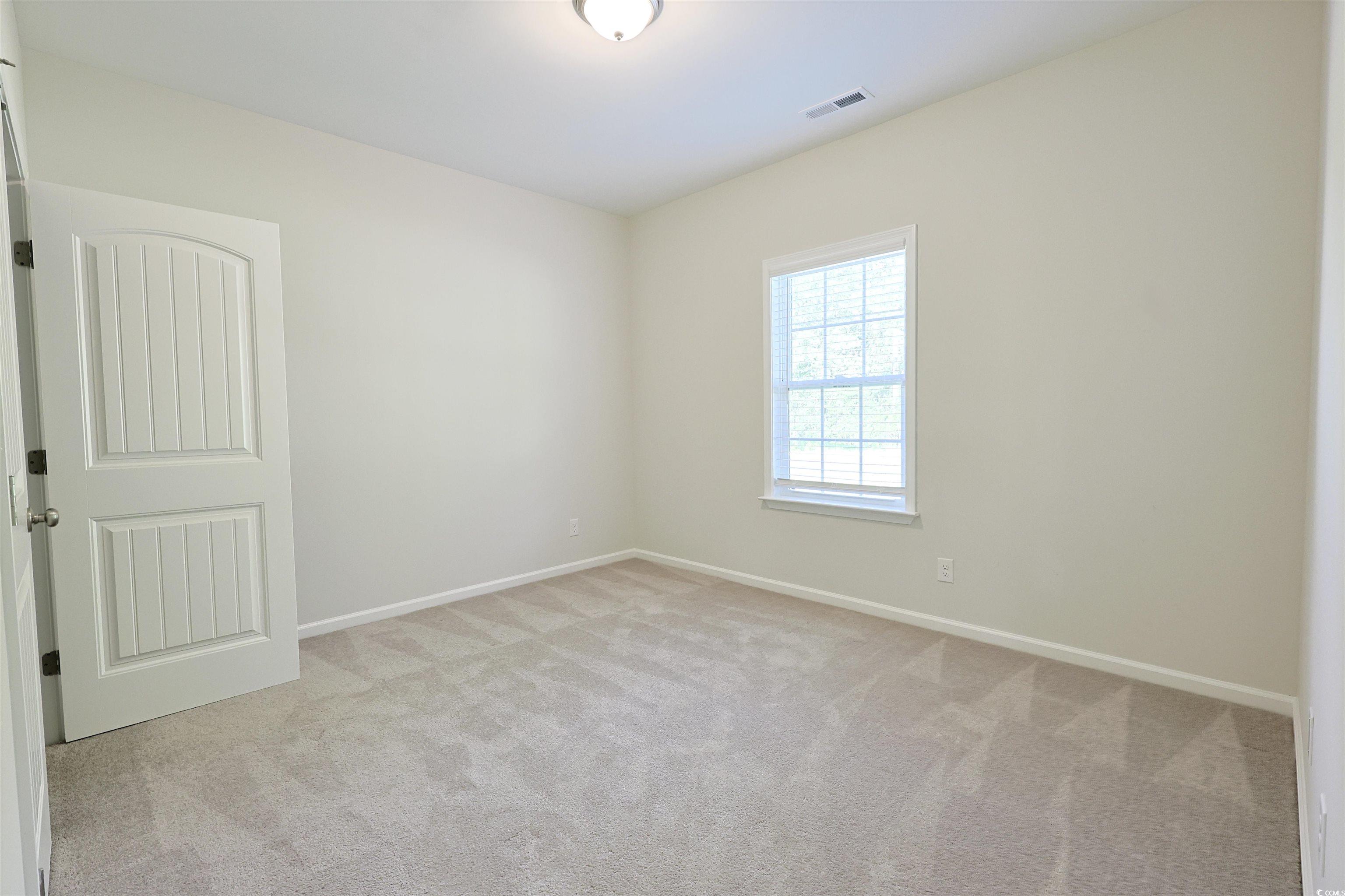266 Ole Maple Street Loris, SC 29569 - Photo 20 of 30 Spare room featuring carpet and baseboards