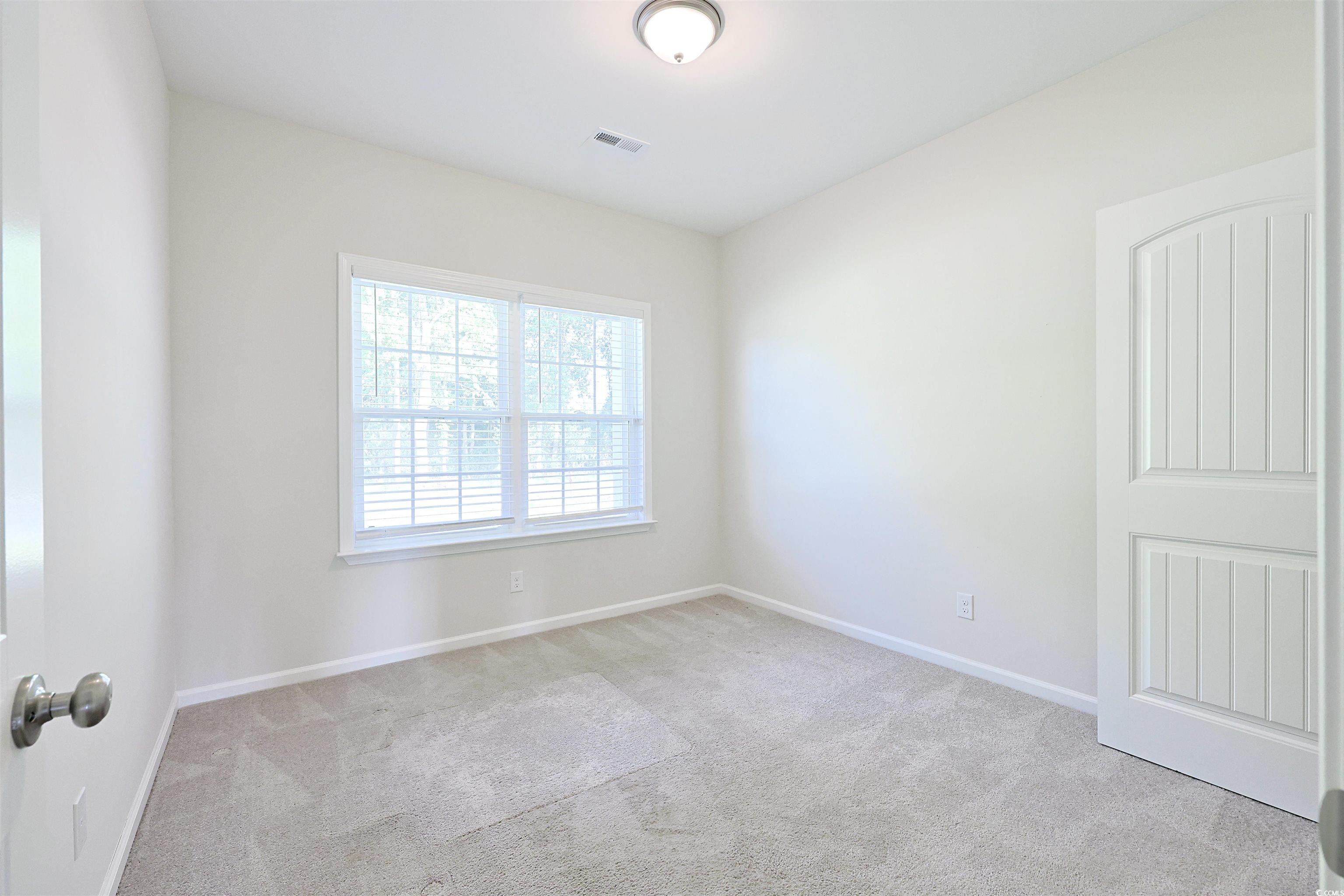 266 Ole Maple Street Loris, SC 29569 - Photo 22 of 30 Carpeted spare room featuring baseboards