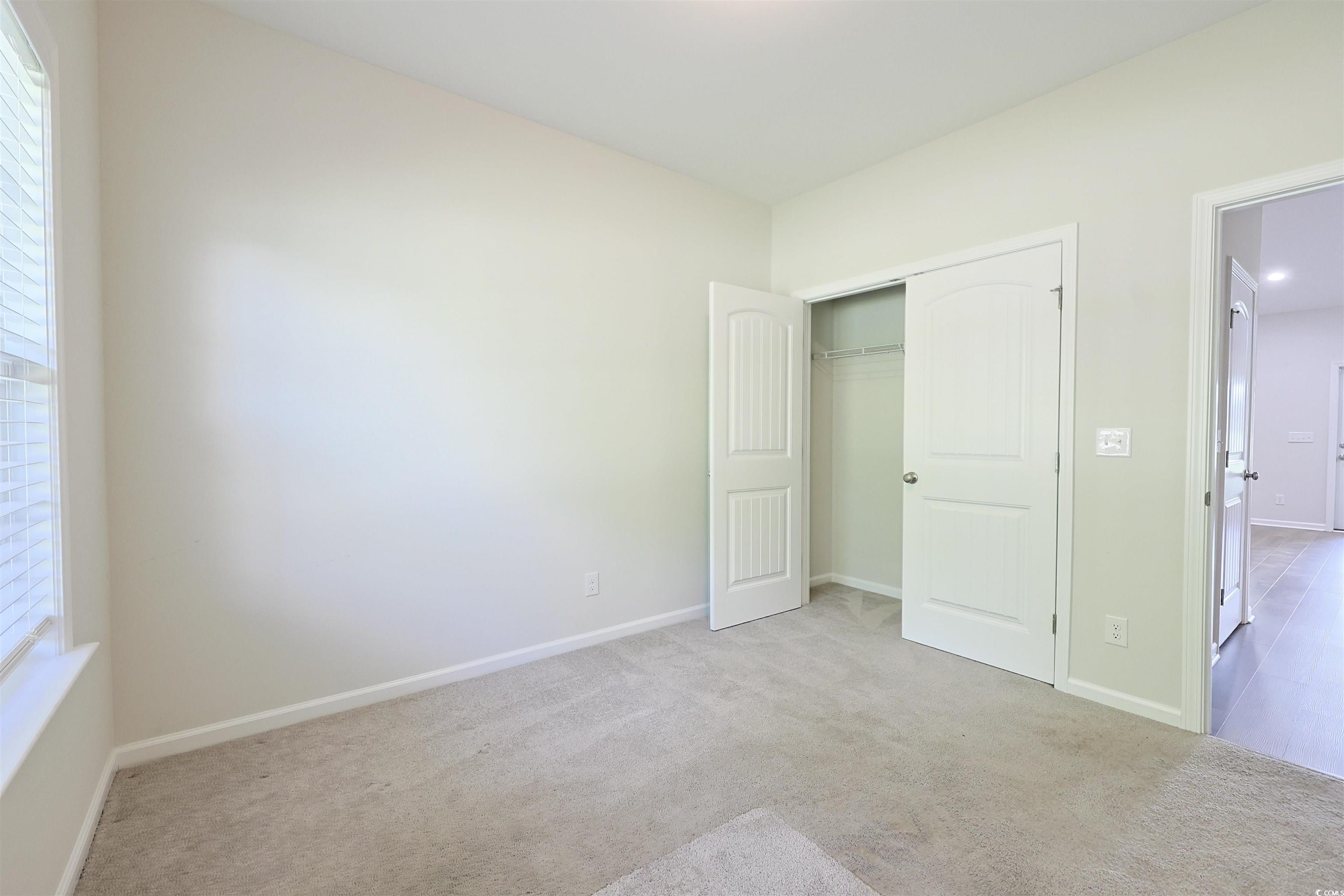 266 Ole Maple Street Loris, SC 29569 - Photo 23 of 30 Unfurnished bedroom with carpet and a closet
