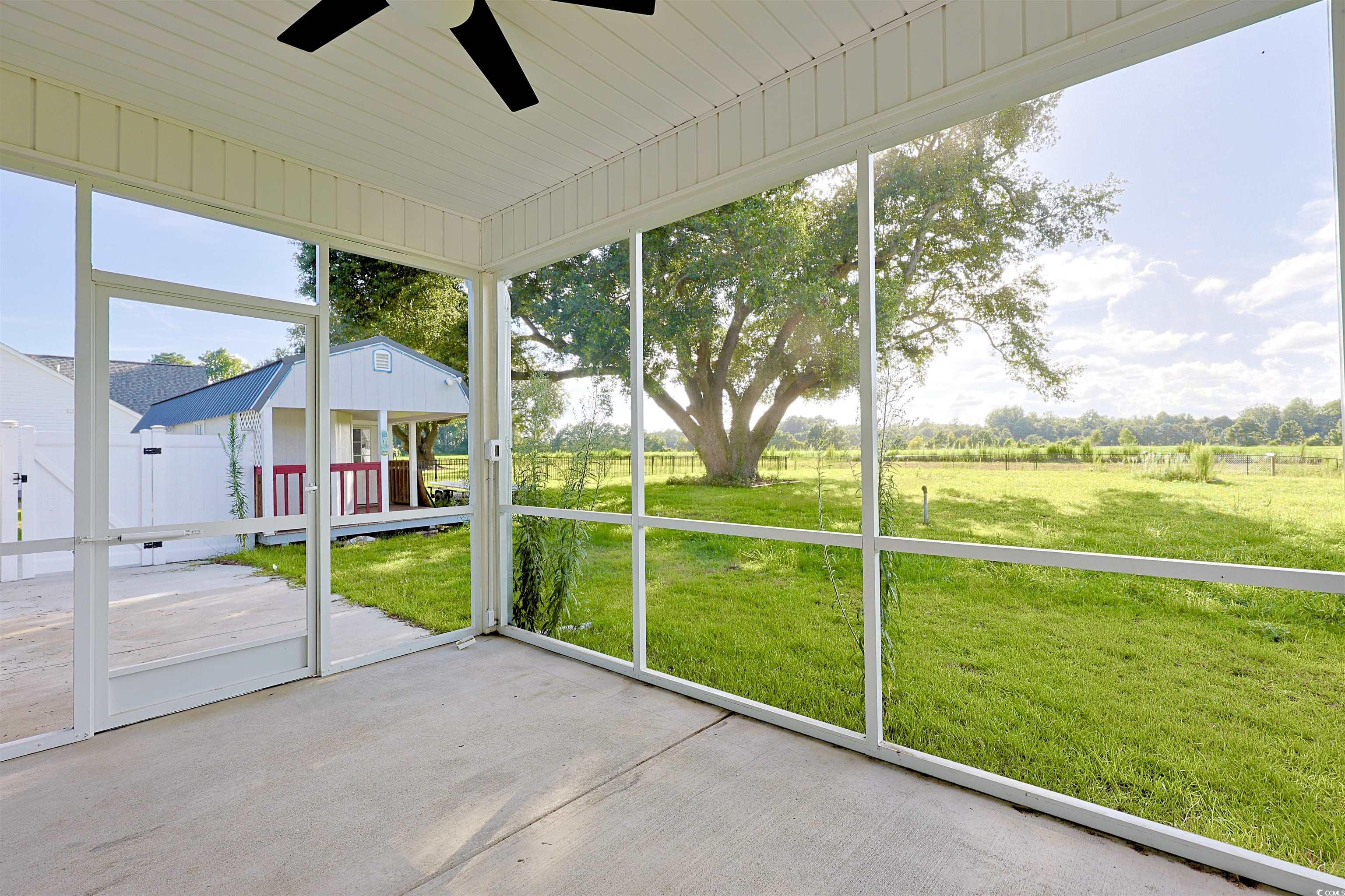 266 Ole Maple Street Loris, SC 29569 - Photo 24 of 30 Unfurnished sunroom with ceiling fan