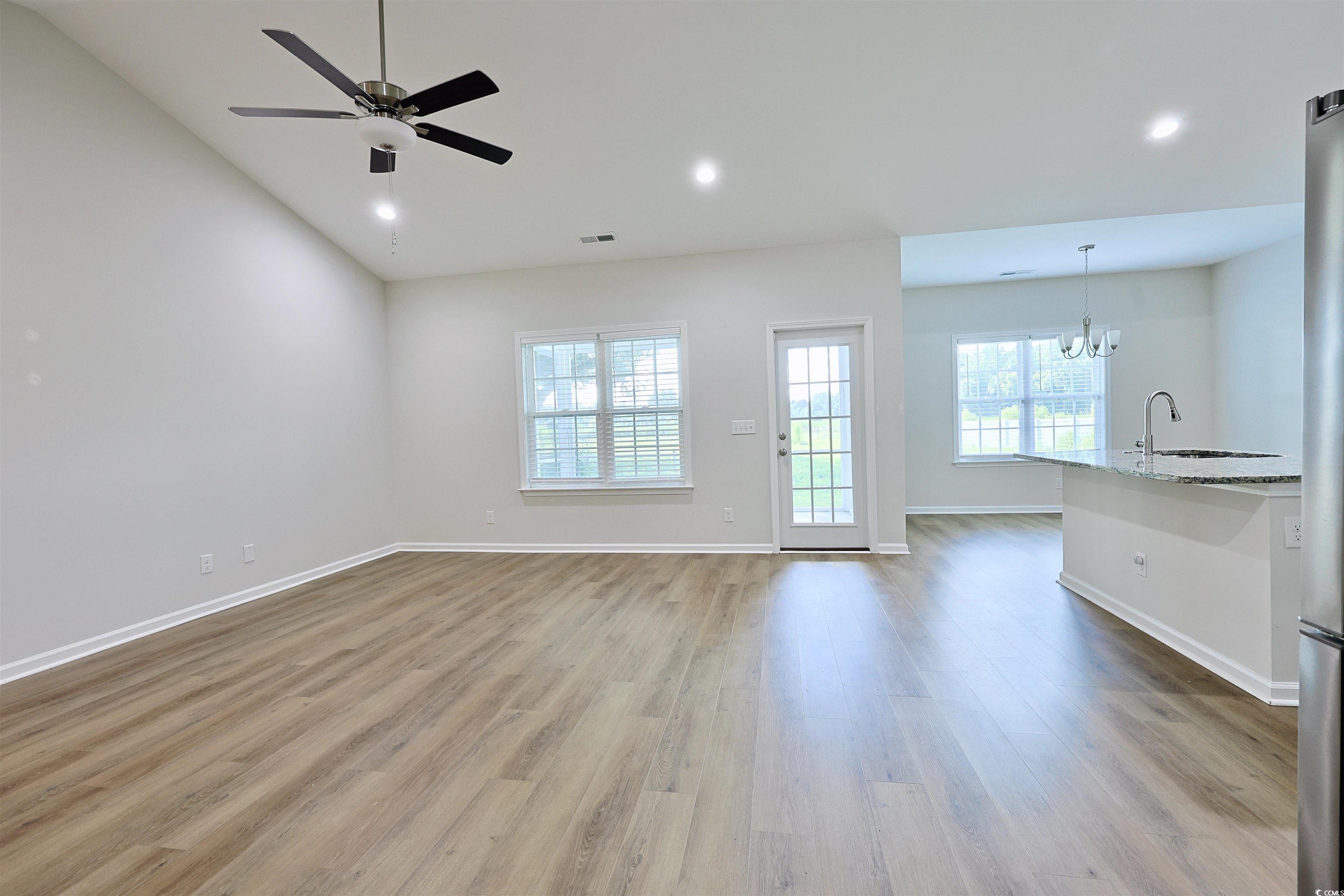 266 Ole Maple Street Loris, SC 29569 - Photo 3 of 30 Unfurnished living room featuring a chandelier, wood finished floors, ceiling fan, and recessed lighting