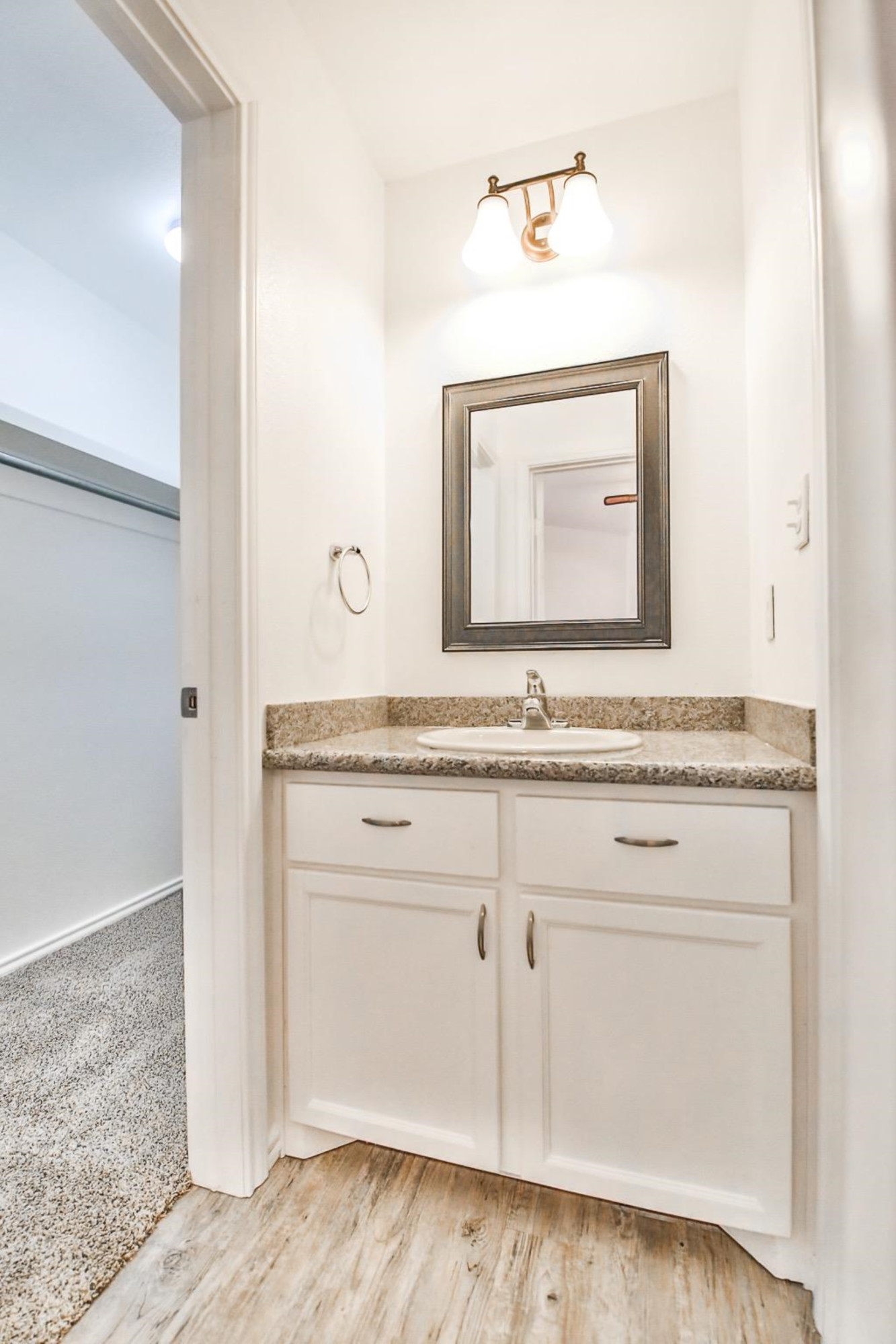5710 Grinnell Street Lubbock, TX 79416 - Photo 13 of 21 a bathroom with a sink and a mirror