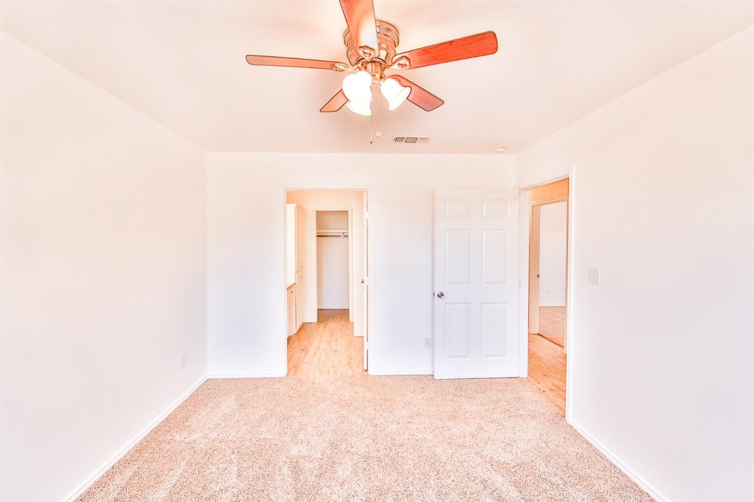 5710 Grinnell Street Lubbock, TX 79416 - Photo 15 of 21 a view of a big room with chandelier fan and a window