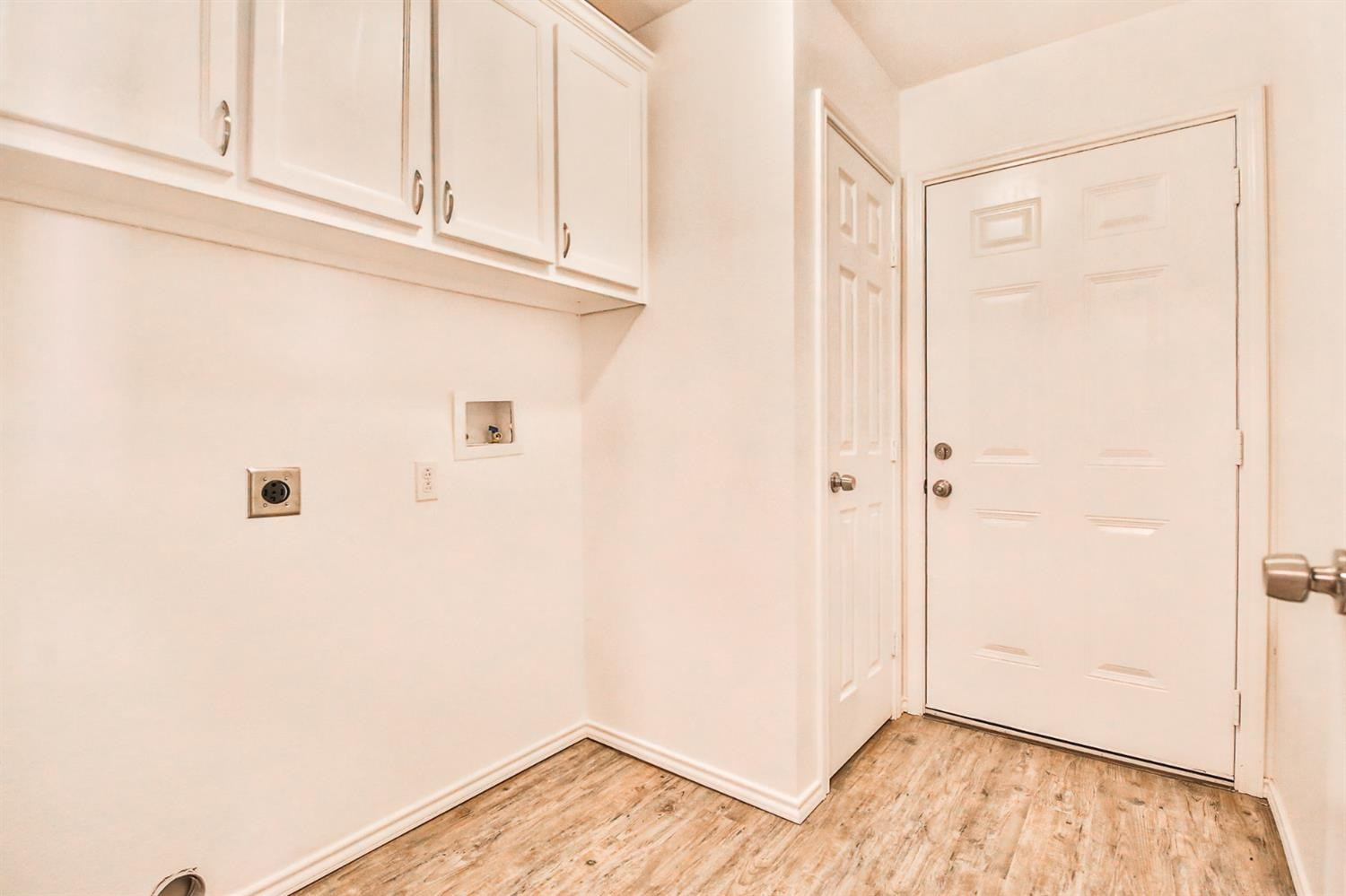 5710 Grinnell Street Lubbock, TX 79416 - Photo 7 of 21 a view of a closet area with wooden floor