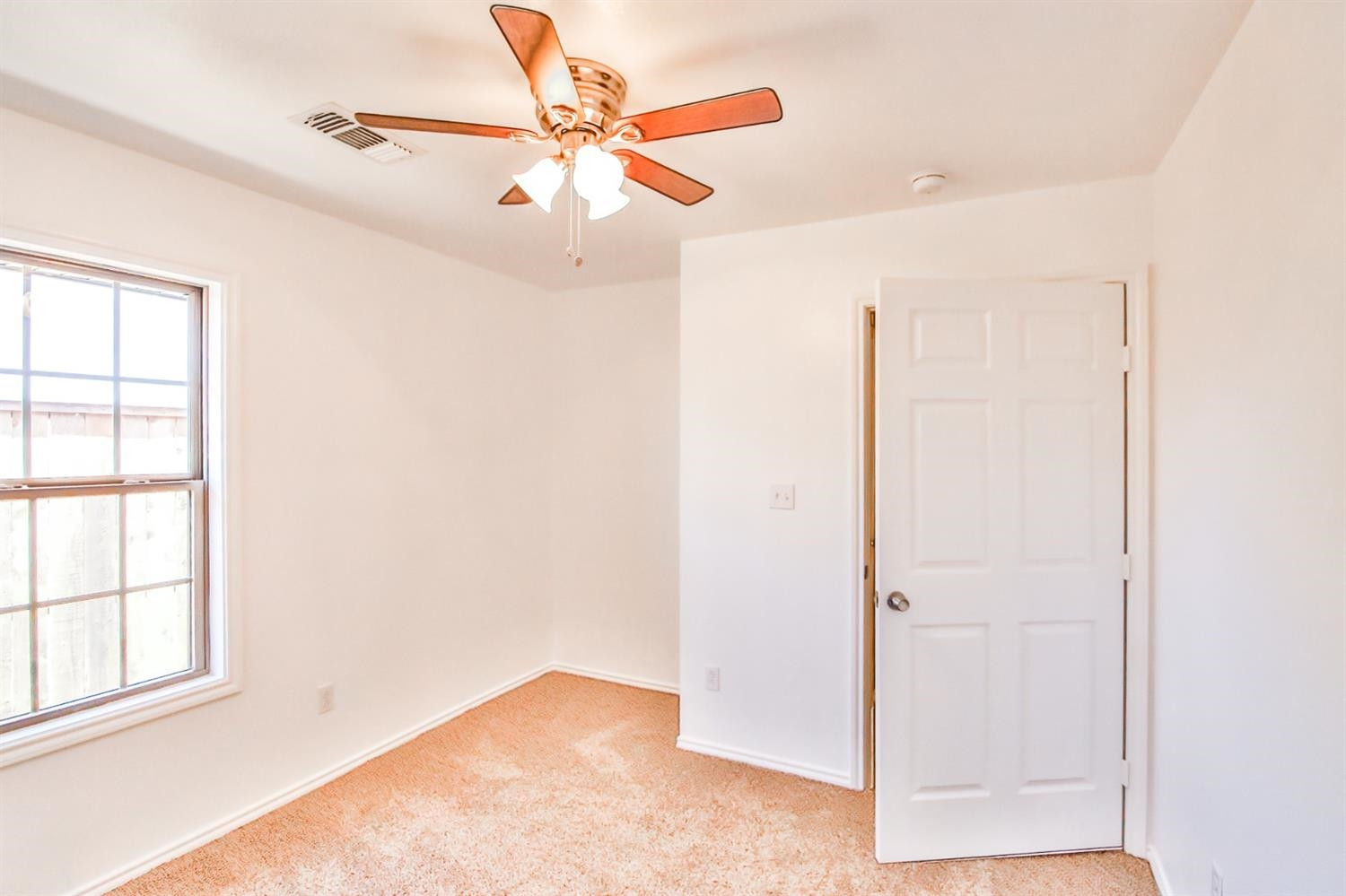 5710 Grinnell Street Lubbock, TX 79416 - Photo 9 of 21 an empty room with a window