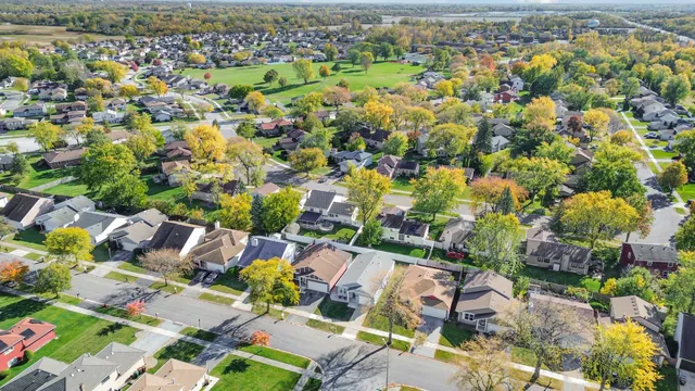 an aerial view of residential houses with outdoor space