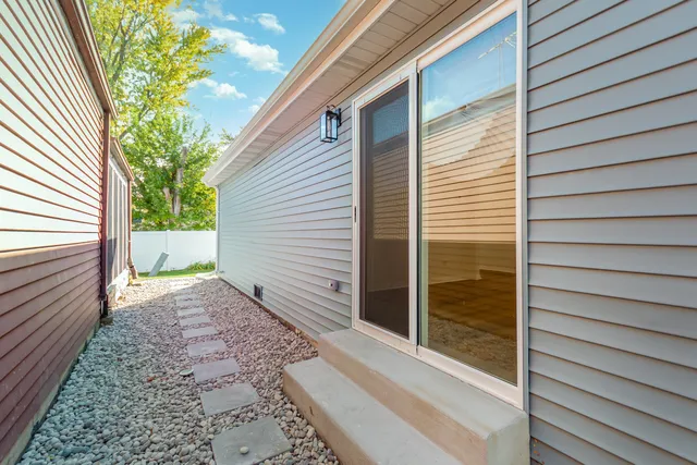 a view of a house with a backyard