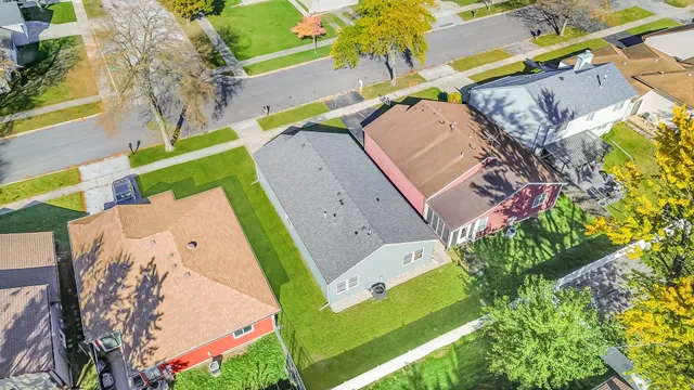 an aerial view of a house with a swimming pool