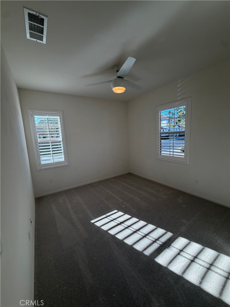 15 Galan Street Rancho Mission Viejo, CA 92694 - Photo 13 of 24 a view of an empty room with windows