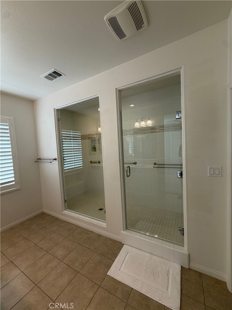15 Galan Street Rancho Mission Viejo, CA 92694 - Photo 18 of 24 a bathroom with a shower