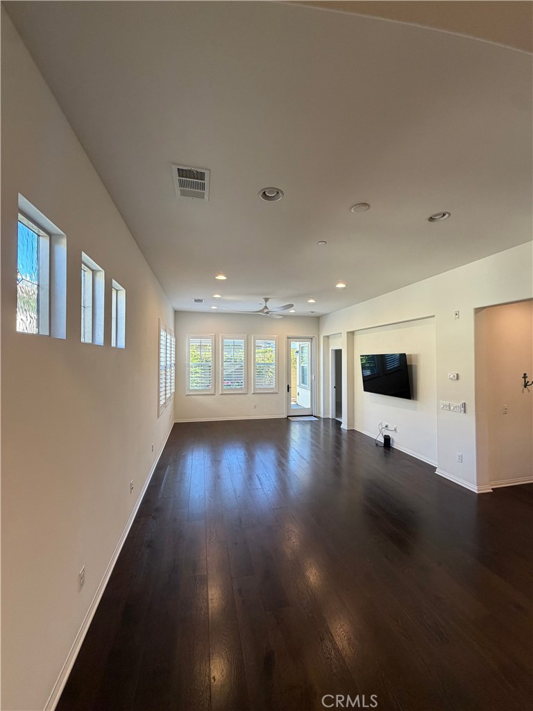 15 Galan Street Rancho Mission Viejo, CA 92694 - Photo 5 of 24 a view of a living room with hardwood floor and window
