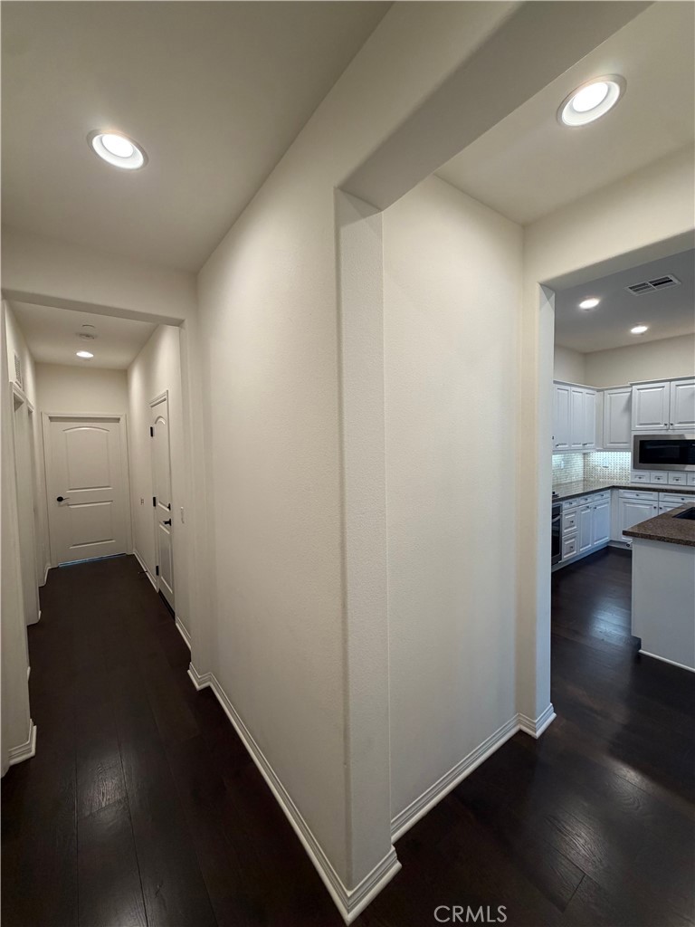 15 Galan Street Rancho Mission Viejo, CA 92694 - Photo 9 of 24 a view of hallway with wooden floor