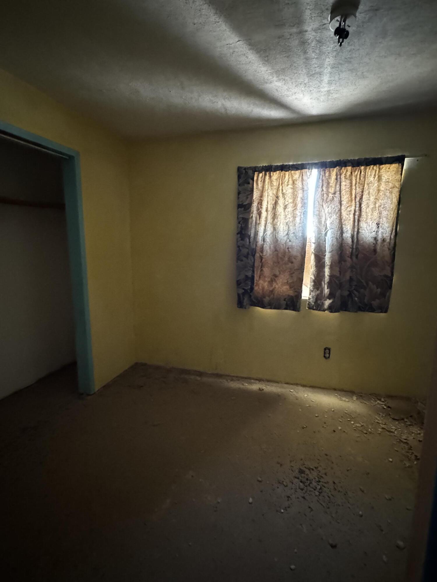 757 Mt Nebo Road Joshua Tree, CA 92252 - Photo 12 of 17 an empty room with windows
