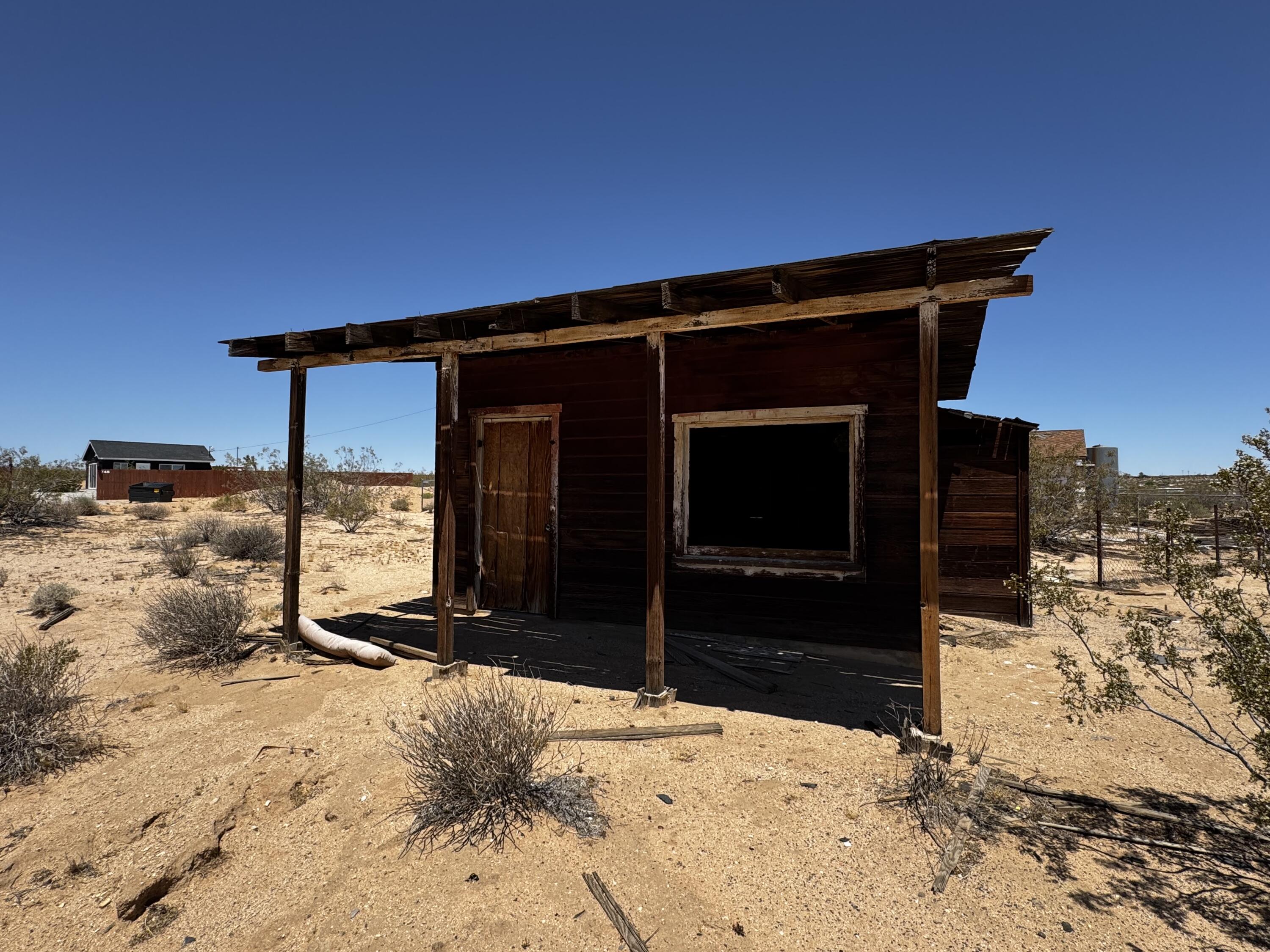 757 Mt Nebo Road Joshua Tree, CA 92252 - Photo 16 of 17 a view of a house with a yard