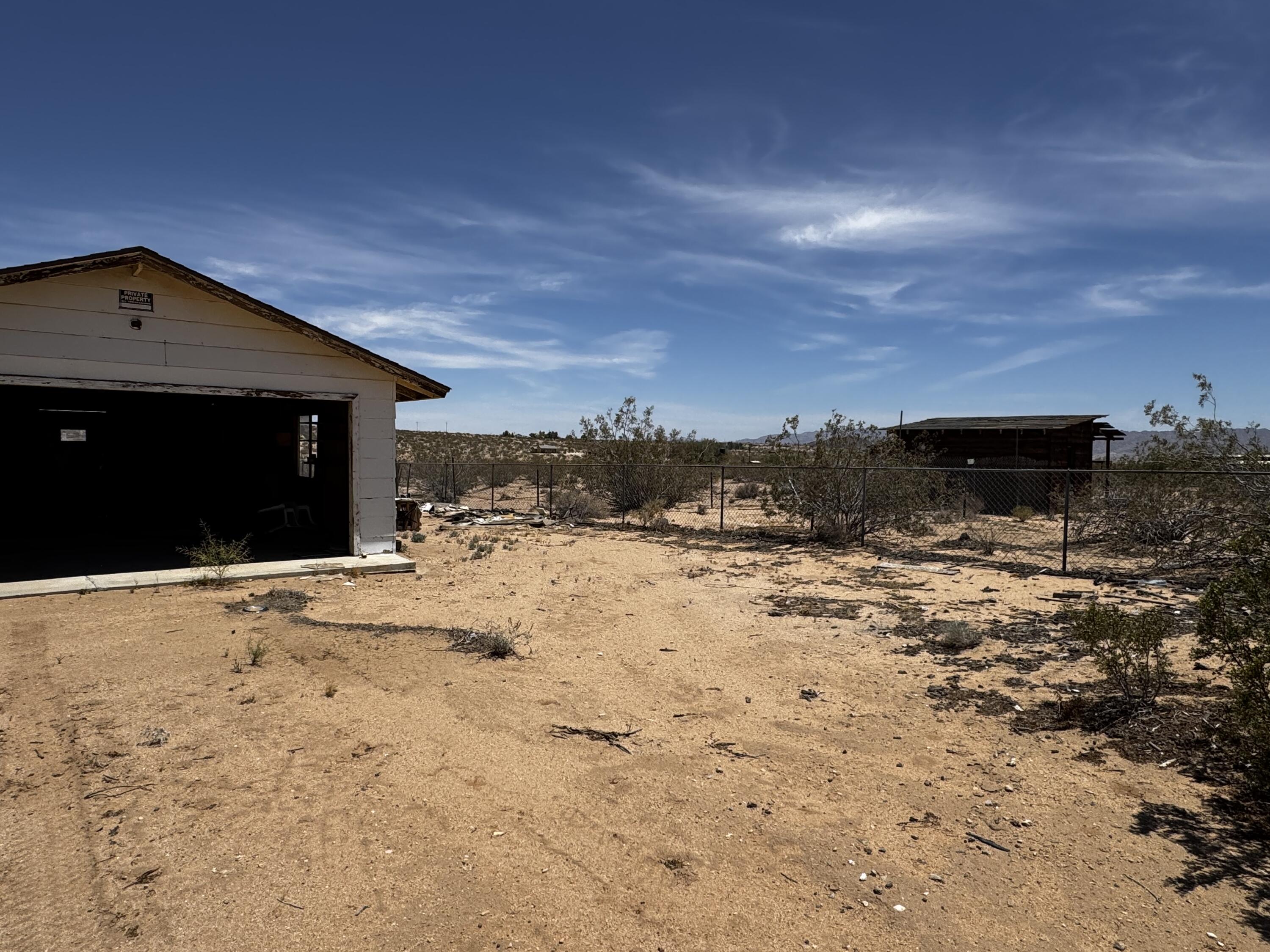 757 Mt Nebo Road Joshua Tree, CA 92252 - Photo 4 of 17 a view of a dry yard covered with snow