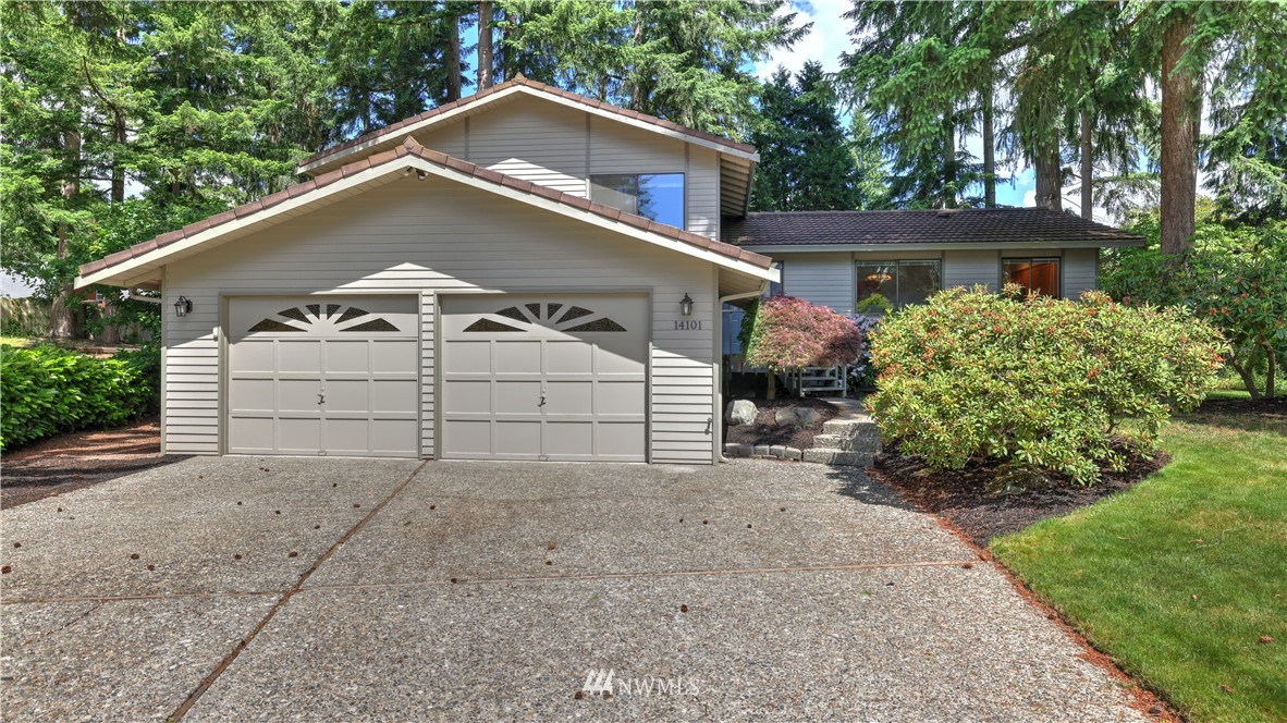 14101 148th Place Southeast Renton, WA 98059 - Photo 1 of 36 front view of a house with a small yard and a large tree