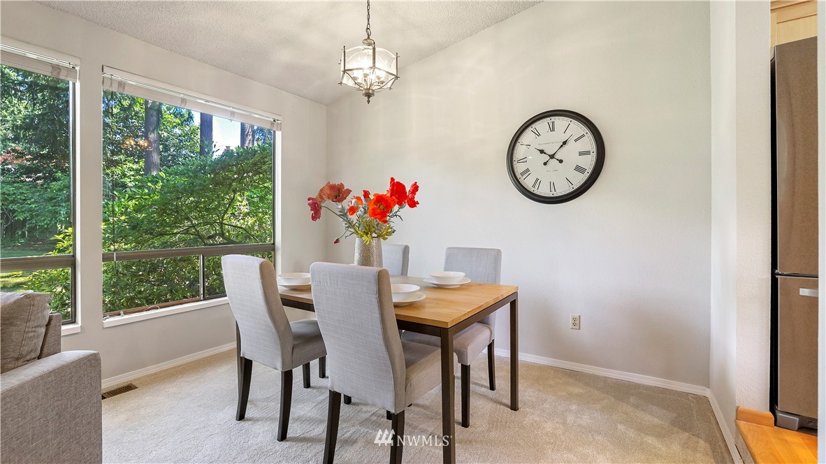 14101 148th Place Southeast Renton, WA 98059 - Photo 11 of 36 a view of a dining room with furniture window and outside view