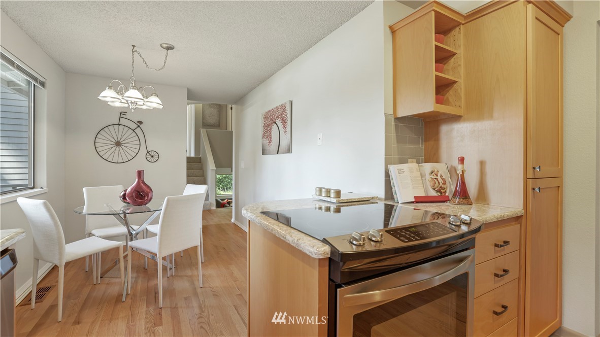 14101 148th Place Southeast Renton, WA 98059 - Photo 14 of 36 a kitchen with a table and chairs