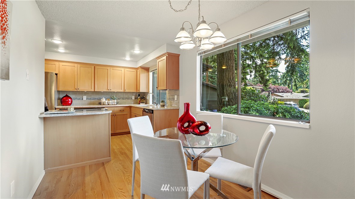 14101 148th Place Southeast Renton, WA 98059 - Photo 17 of 36 a kitchen with a table and chairs in it
