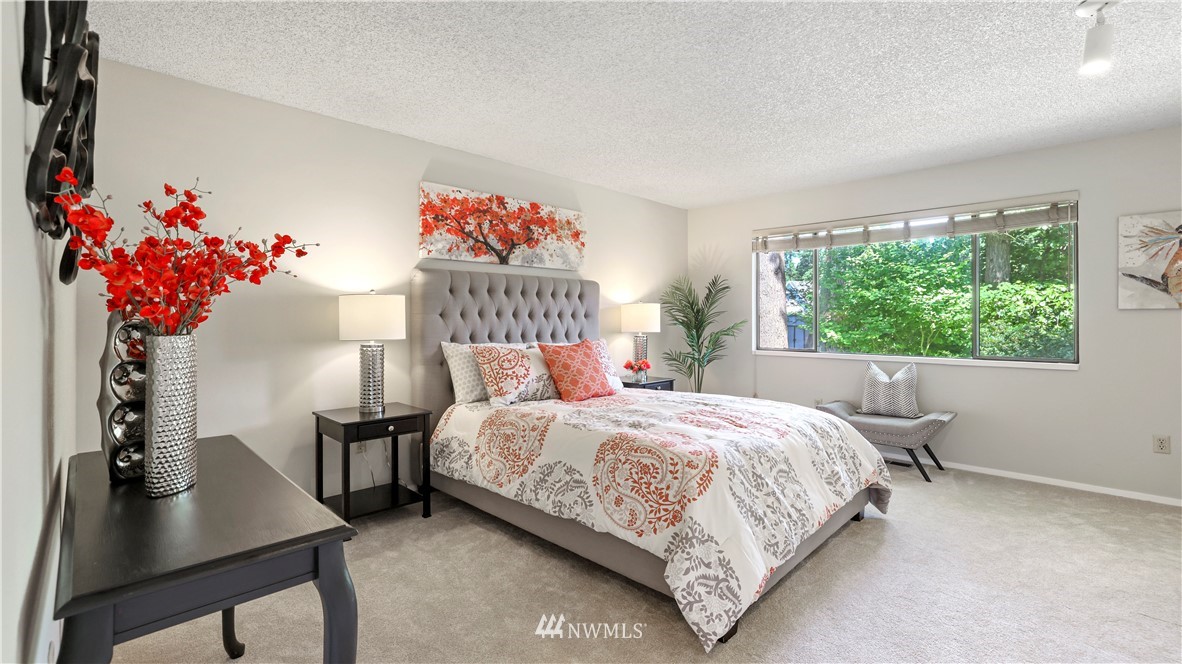 14101 148th Place Southeast Renton, WA 98059 - Photo 23 of 36 a bedroom with a bed and a table