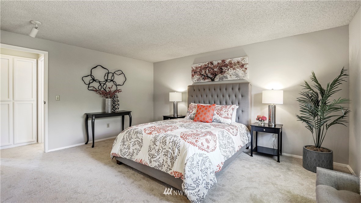 14101 148th Place Southeast Renton, WA 98059 - Photo 24 of 36 a bedroom with bed and a potted plant