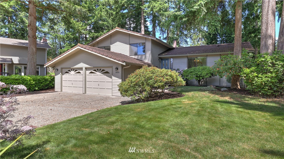 14101 148th Place Southeast Renton, WA 98059 - Photo 4 of 36 a front view of a house with a yard and garage