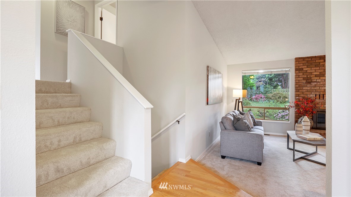 14101 148th Place Southeast Renton, WA 98059 - Photo 6 of 36 a living room with furniture and a large window