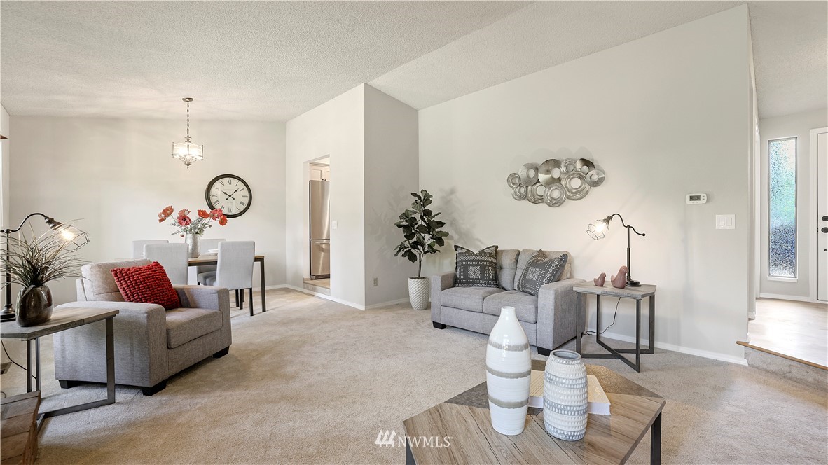 14101 148th Place Southeast Renton, WA 98059 - Photo 10 of 36 a living room with furniture and white walls