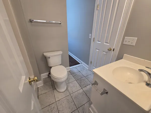 a bathroom with a sink and toilet