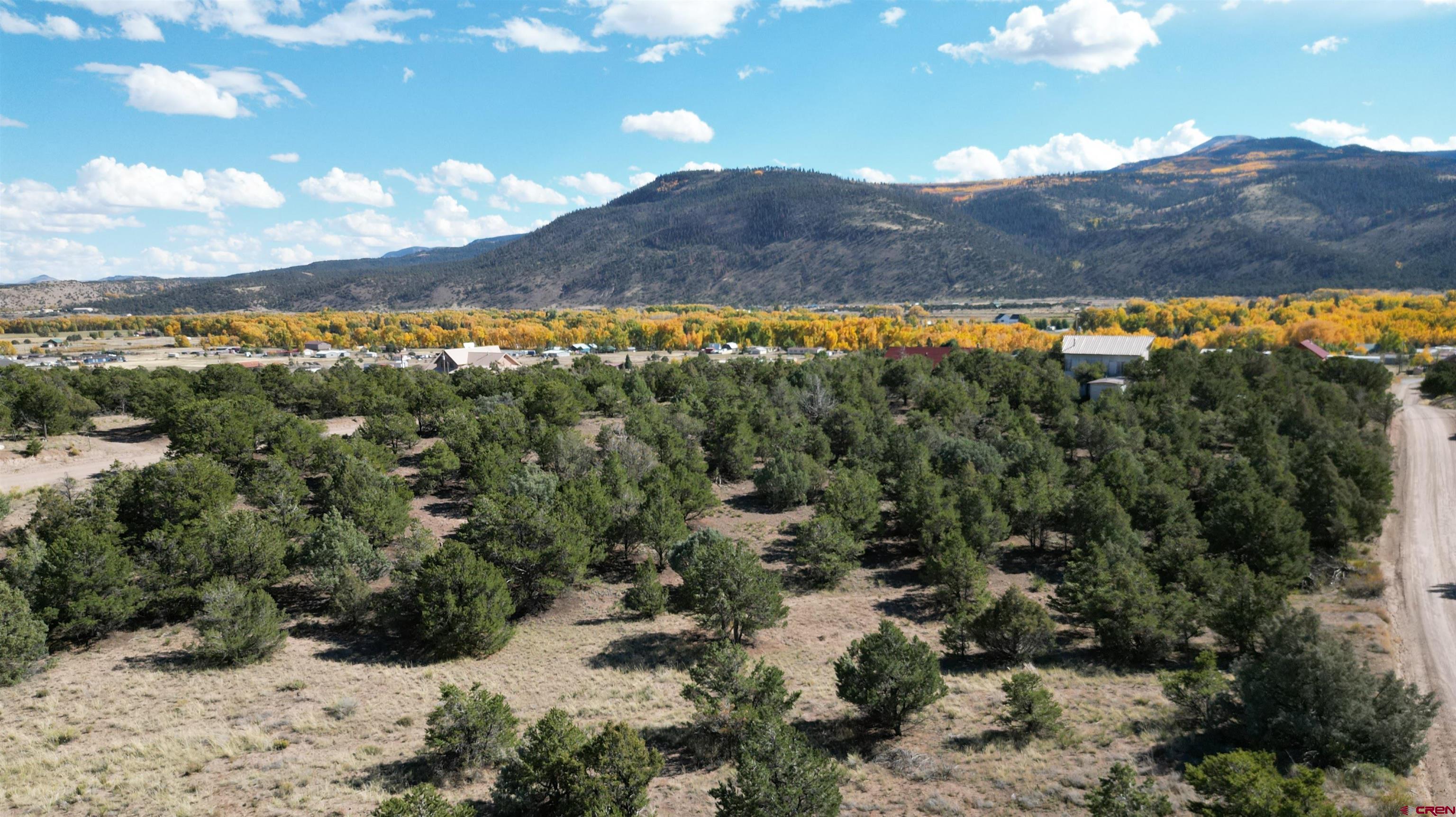 549 Milner Pass Road South Fork, CO 81154 - Photo 2 of 19 a view of a city with mountains in the background
