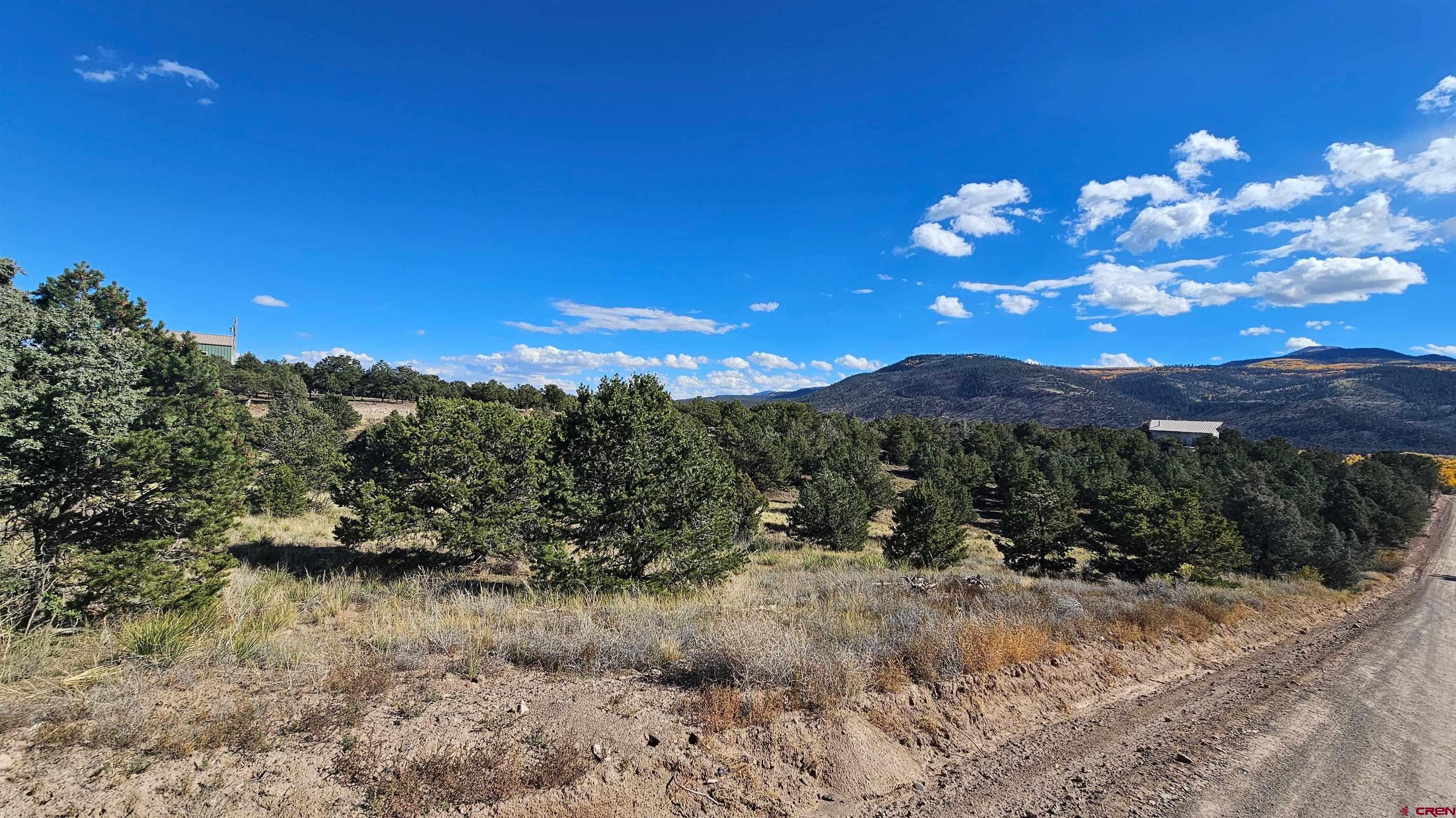 549 Milner Pass Road South Fork, CO 81154 - Photo 8 of 19 a view of a lake with a mountain in the background