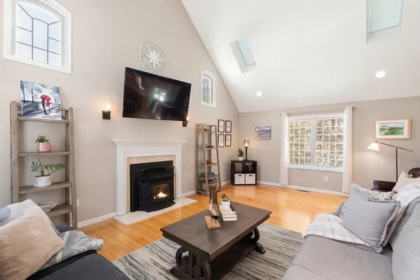 a living room with furniture or couch and a dining table