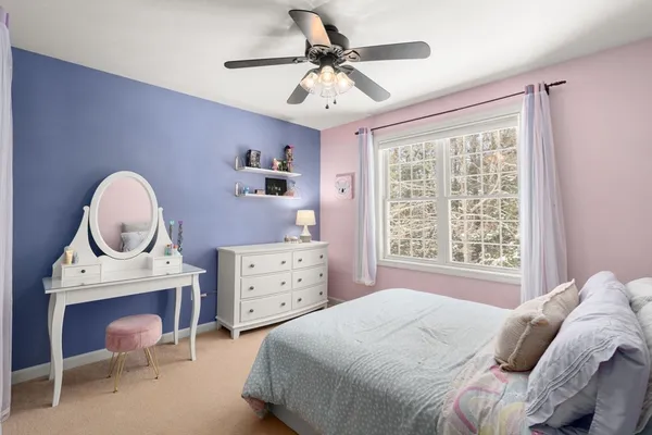 a bedroom with a bed and window