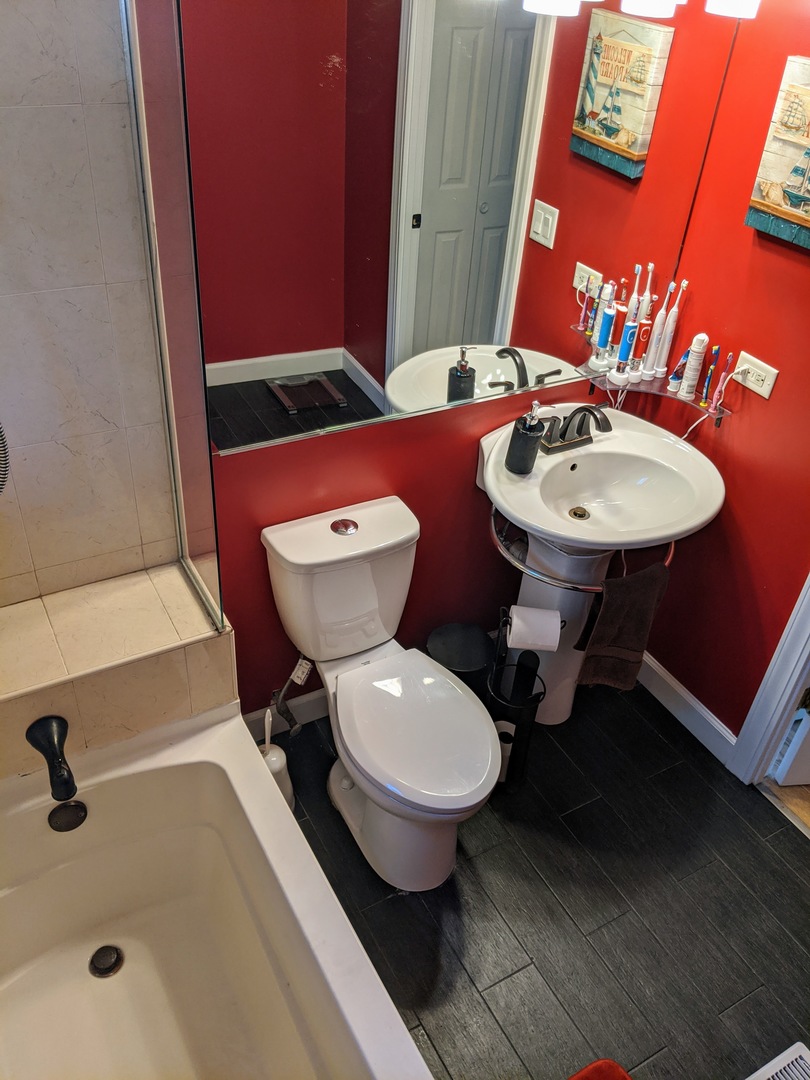 14 East Oltendorf Road Streamwood, IL 60107 - Photo 16 of 21 a bathroom with a sink toilet and a mirror