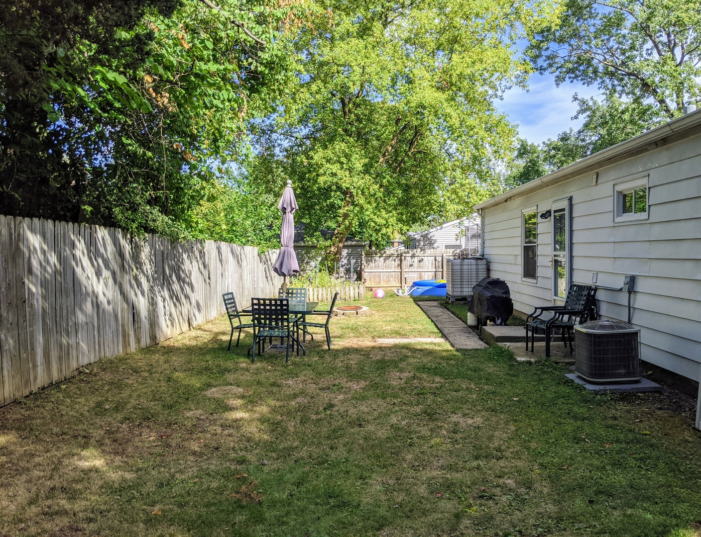 14 East Oltendorf Road Streamwood, IL 60107 - Photo 21 of 21 a view of a house with backyard sitting area and garden