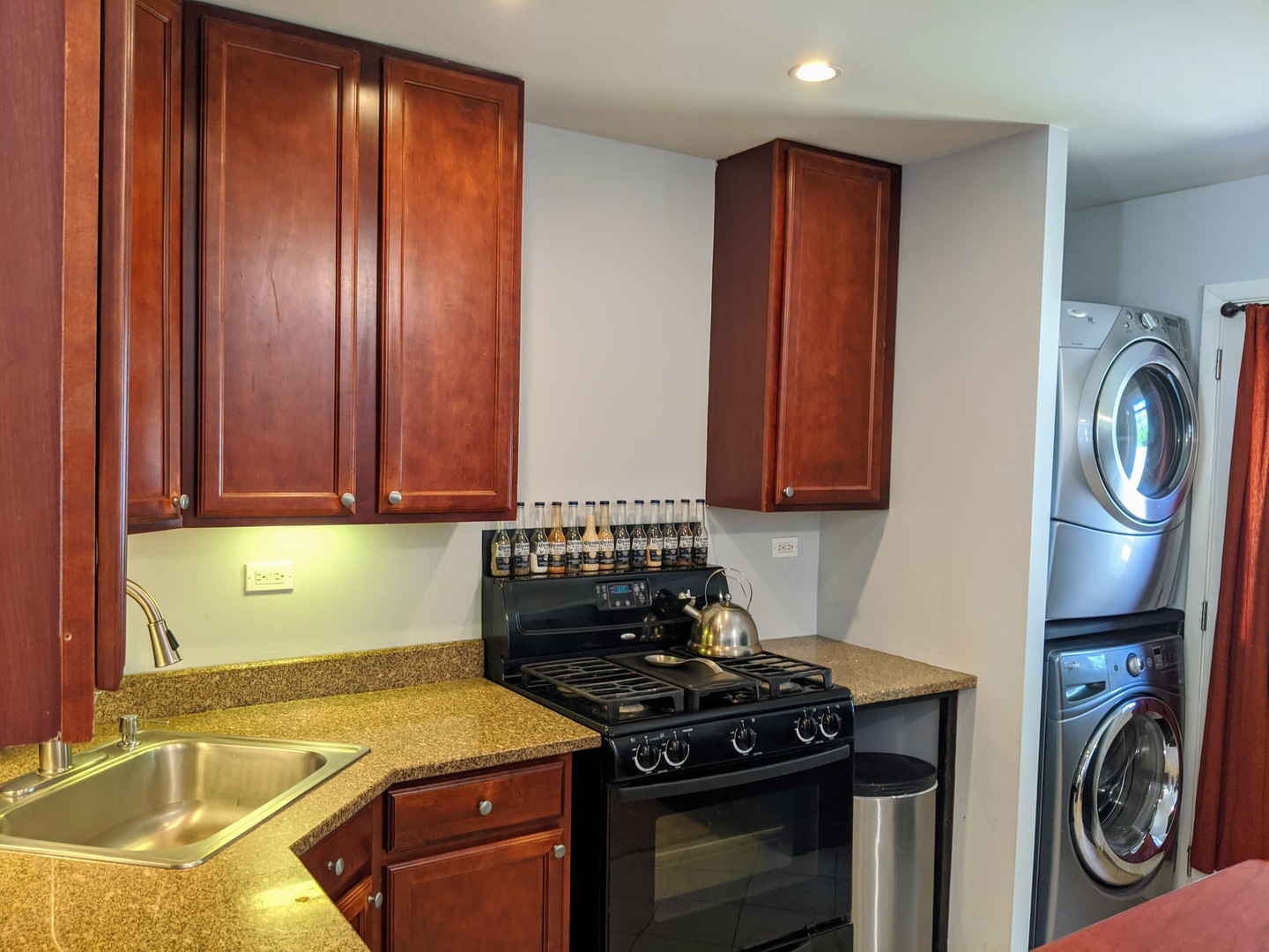 14 East Oltendorf Road Streamwood, IL 60107 - Photo 4 of 21 a kitchen with granite countertop a sink and a stove top oven