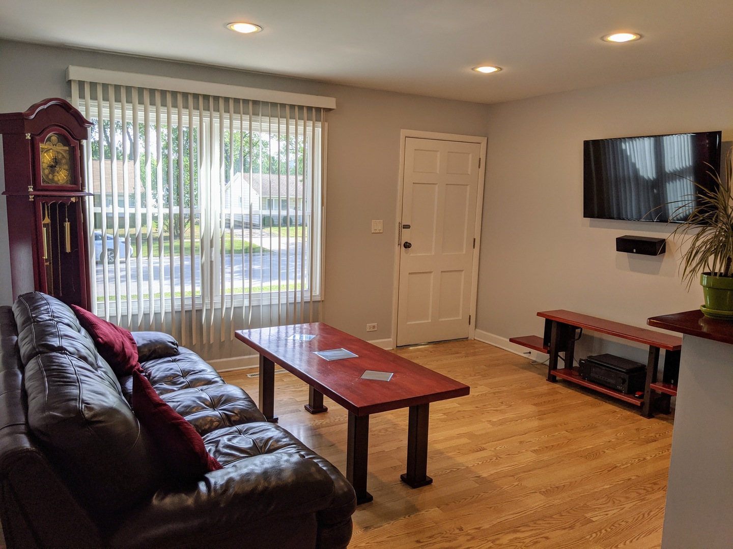 14 East Oltendorf Road Streamwood, IL 60107 - Photo 9 of 21 a living room with furniture a flat screen tv and a window
