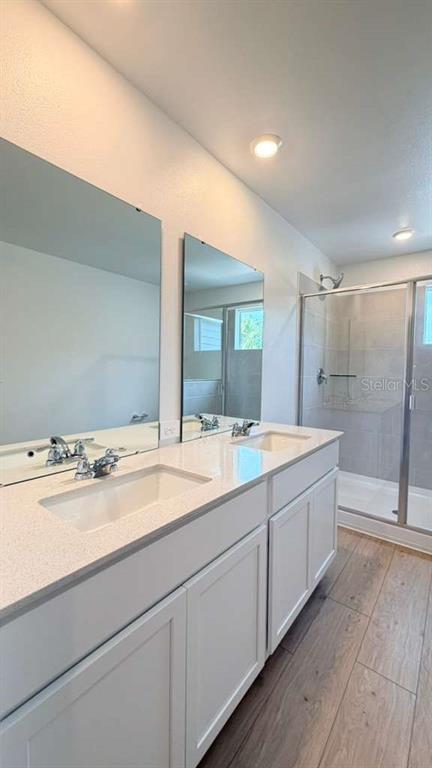 5174 Clay Whaley Road St. Cloud, FL 34772 - Photo 20 of 25 a bathroom with a granite countertop sink mirror and toilet