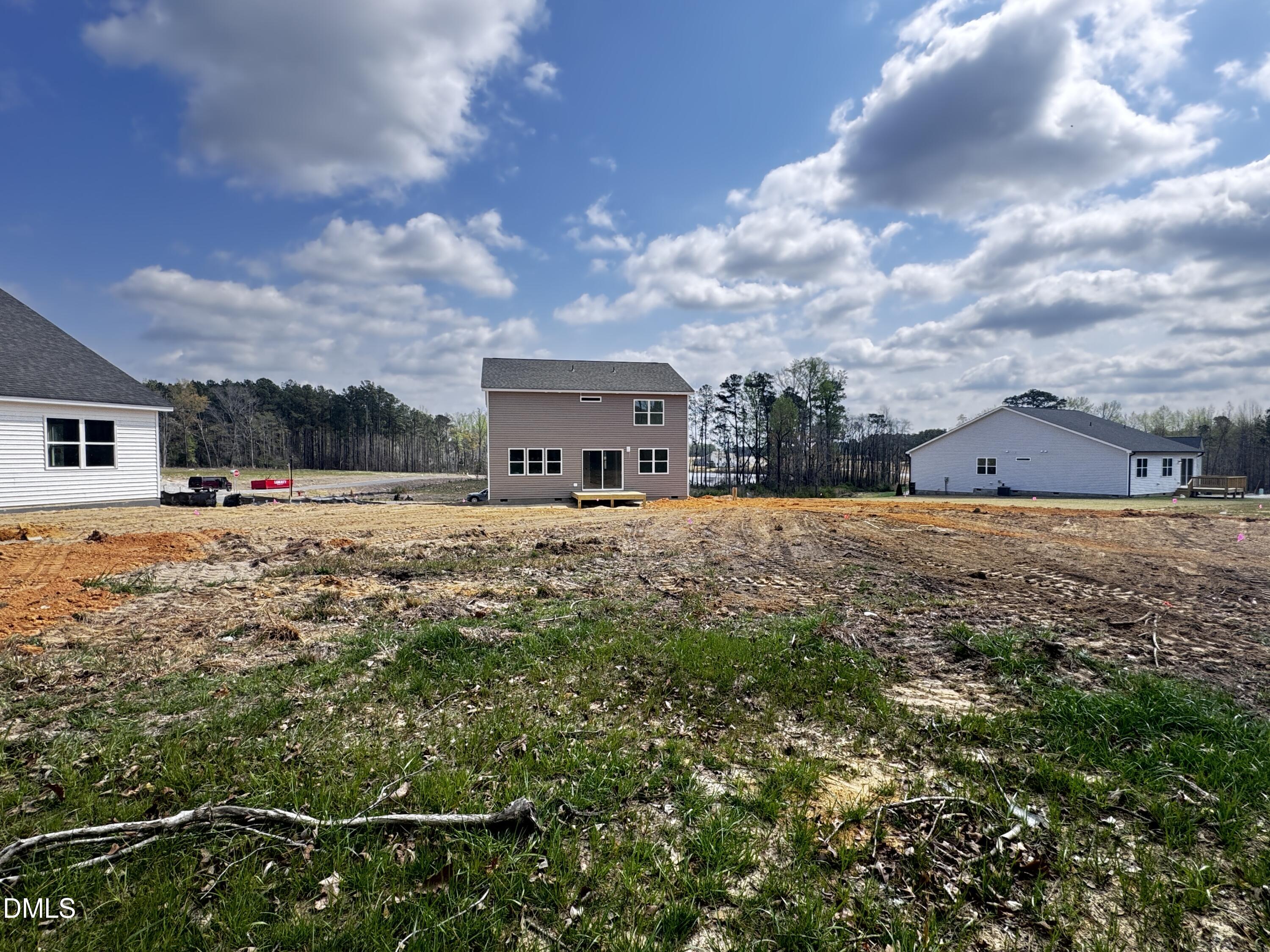 263 Kindness Drive Lillington, NC 27546 - Photo 20 of 37 a view of a house with yard and sitting area