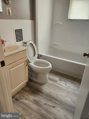 a bathroom with a sink toilet and bathtub