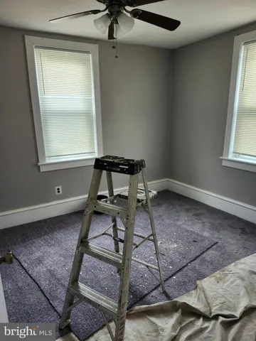 a room with gym equipment and a window