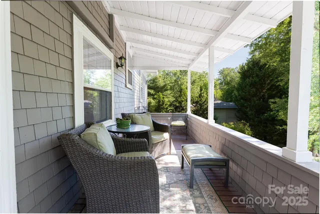 a view of balcony with couch and outdoor seating