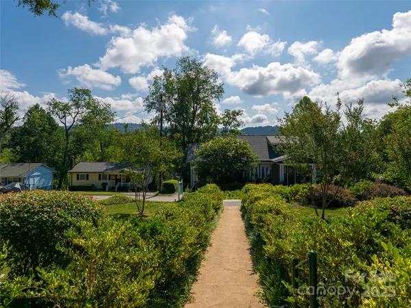 a view of a garden with houses