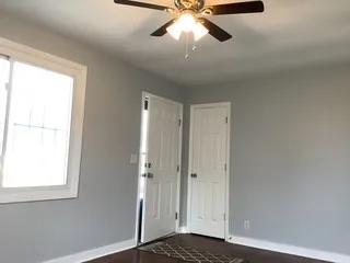 a view of an empty room and window