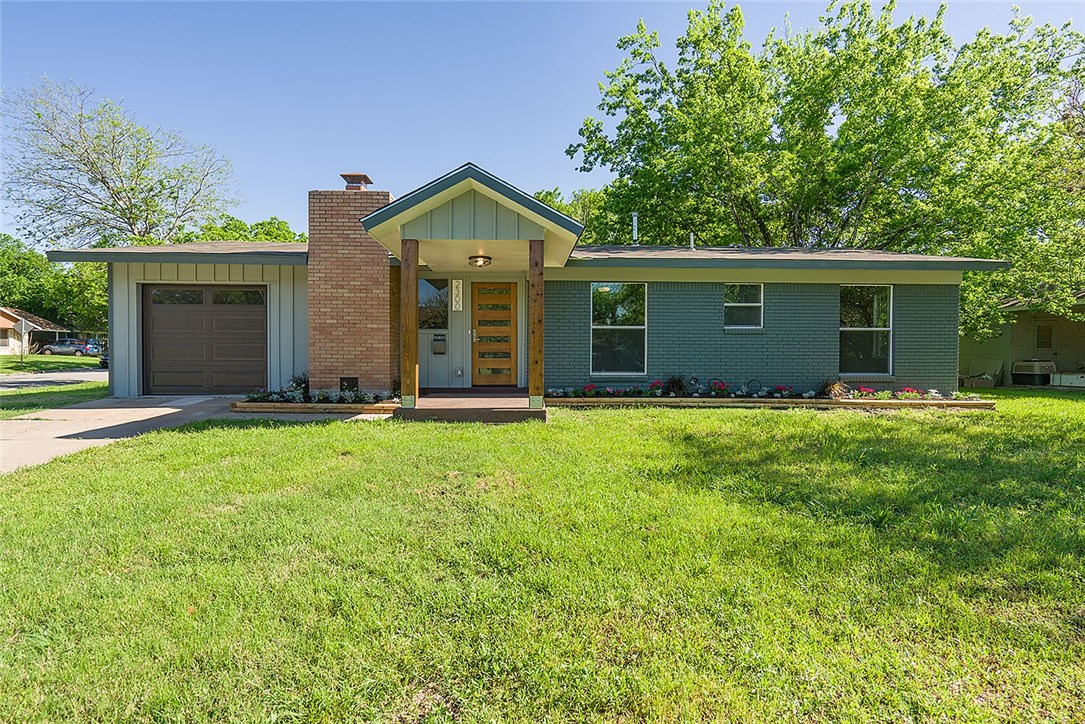 front view of a house with a yard