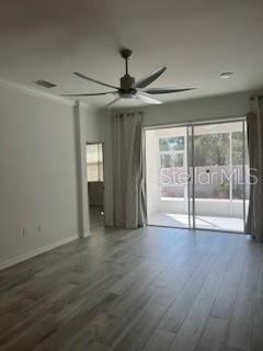 7947 Southwest 89th Loop Ocala, FL 34476 - Photo 11 of 25 a view of an empty room with window and wooden floor