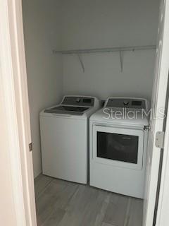 7947 Southwest 89th Loop Ocala, FL 34476 - Photo 12 of 25 a utility room with washer and dryer