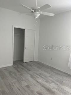 7947 Southwest 89th Loop Ocala, FL 34476 - Photo 13 of 25 an empty room with a ceiling fan and a window