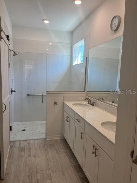 7947 Southwest 89th Loop Ocala, FL 34476 - Photo 15 of 25 a bathroom with a double vanity sink and mirror