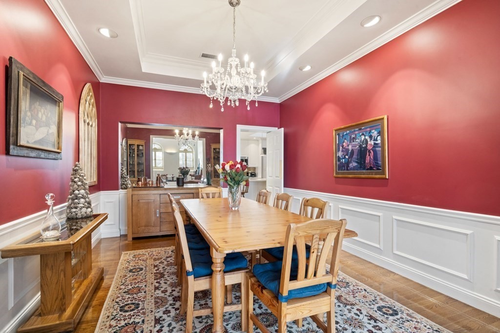 49 Rawson Road, Unit 49 Brookline, MA 02445 - Photo 12 of 42 a view of a dining room with furniture and a chandelier